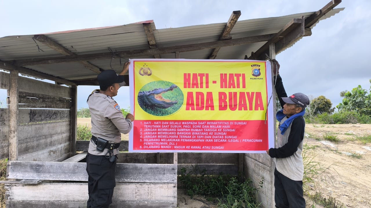 Polsek Pujud Pasang Spanduk Peringatan Bahaya Hewan Buas, Warga Diminta Hati-hati