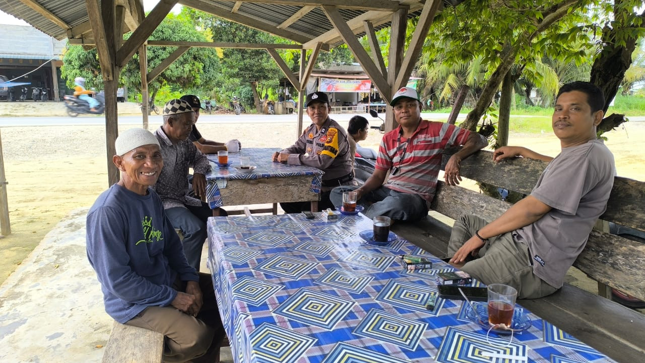 Polsek Pujud Sampaikan Pesan Pilkada Damai ke Warga Teluk Nayang